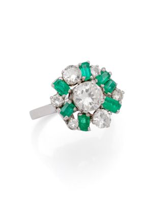 an emerald and diamond cluster ring