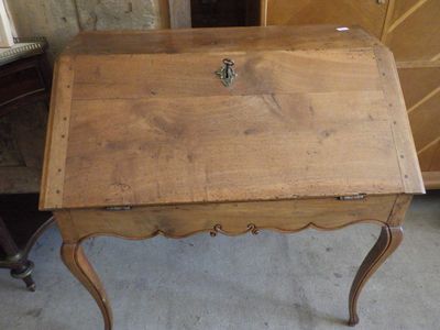 a small wooden table with a drawer on top of it