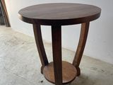 an image of a table made of wood with a curved base