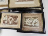 several framed photographs of a group of people in a room