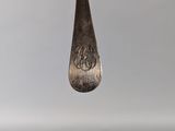 a close up of a spoon with a number on it