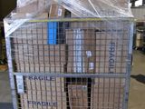a large metal cart with boxes on it in a warehouse