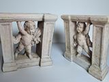 two statues of cherensils are sitting on top of each other