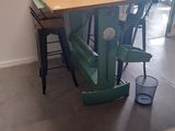 a table and chairs in a room with a window