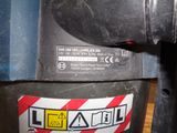 a close up of a machine with a warning sign on it