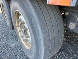 a close up of a flat tire on a semi truck