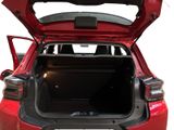 the back of a red car with its trunk open on a white background