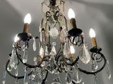 a chandelier that has a lot of crystal hanging from it