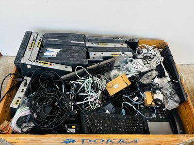 a wooden box filled with electronic equipment on the floor