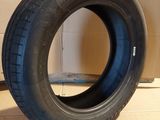 tires on a cardboard box with a cardboard box in the background