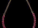 un collier en or et rubis sur fond noir