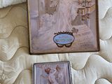 a picture of a picture of a woman in a dress on a bed