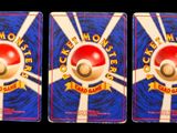 three cards with a red and white ball on top of each other