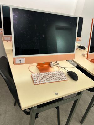 two computer screens on the desk with a keyboard and mouse
