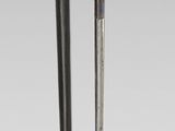 pair of black and gold chopsticks with a gold - plated handle