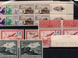 several stamps from different countries are on display on a black surface