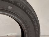 a close up of a tire on a white surface