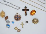 several different types of jewelry are displayed on a white surface