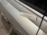 a measuring tape on the side of a car door