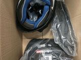 a box with a helmet and other items inside of it