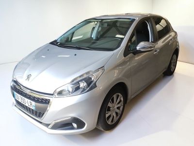 a silver car that is on display in a showroom