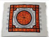 an orange and black square with a circular design on it