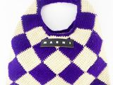 purple and white crocheted bag with a name tag on it