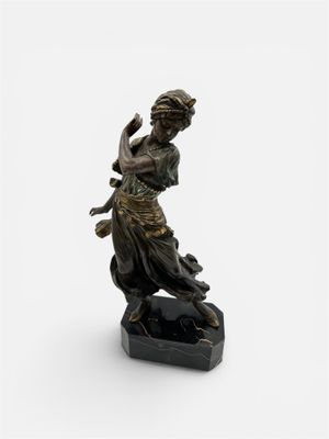 an image of a statue of a woman on a rock