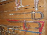 a wooden wall that has a bunch of tools on it