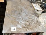 a table that has a lot of stuff on top of it