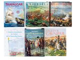 plusieurs livres pour enfants sont alignés sur une surface blanche