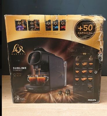 the box of the coffee machine is open on the table