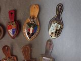 many different types of luggage tags hanging on a wall