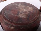 a large brown pot with a handle on a table