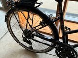 a bike that is parked in front of a window