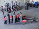 a lot of red and black forklifts in a garage