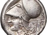 a close up of a coin with a man ' s head on it