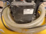 an image of a machine with a hose attached to it
