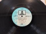 an old record with a label on it sitting on a table