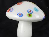 a white mushroom with multicolored dots on it