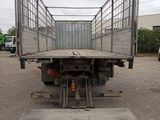 an image of a truck with a flat bed in a parking lot