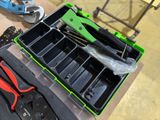a tool box with tools and pliers on a table