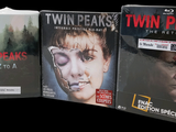 three dvds that are sitting on a table together