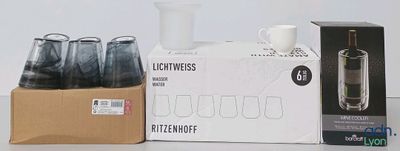 a box of coffee and a cup on a table