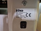 a label on the side of a machine that says zund