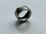 an image of a silver ring on a white surface
