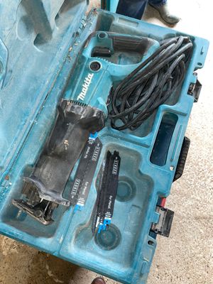 a blue tool box with tools in it on the floor