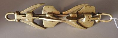 a close up of a metal hook on a white surface