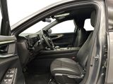the interior of a car with the door open and the driver ' s seat down
