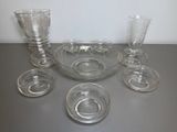 a lot of glasses and a bowl on the table